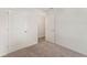 Bedroom with neutral carpet, white walls and two doors leading to other rooms at 230 Ashworth Dr., Tabor City, NC 28463