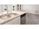 Kitchen featuring a stainless steel sink and dishwasher plus luxury vinyl plank flooring at 230 Ashworth Dr., Tabor City, NC 28463