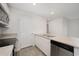 Modern kitchen featuring stainless steel appliances, a double sink, and a neutral countertop at 230 Ashworth Dr., Tabor City, NC 28463