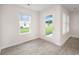Bright sunroom with laminate flooring and glass windows and doors for a beautiful view to the outside at 230 Ashworth Dr., Tabor City, NC 28463