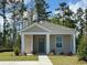 Charming single-story home with neutral siding, green door, and well-maintained landscaping at 244 Ashworth Dr., Tabor City, NC 28463