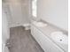 Modern bathroom with double sinks, spacious shower, and plank flooring at 358 Jeff Waters Circle, Longs, SC 29568