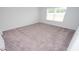 Bright bedroom with neutral carpeting and a large window view at 358 Jeff Waters Circle, Longs, SC 29568