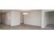 Open concept dining room features wood-look flooring and a modern chandelier at 358 Jeff Waters Circle, Longs, SC 29568