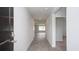 Inviting hallway with hard surface flooring leading to an open living area filled with natural light at 358 Jeff Waters Circle, Longs, SC 29568