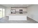 Well-lit kitchen with stainless steel appliances, a kitchen island and modern fixtures at 358 Jeff Waters Circle, Longs, SC 29568