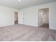 Spacious main bedroom with neutral carpeting and an ensuite bathroom at 358 Jeff Waters Circle, Longs, SC 29568