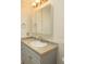 Bathroom vanity with silver hardware, tiled backsplash and a mirror at 340 Walden Lake Rd., Conway, SC 29526