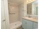 Bright bathroom featuring a walk-in shower with handrails and a blue vanity with plenty of storage at 340 Walden Lake Rd., Conway, SC 29526