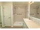 Bright bathroom with a step-in shower, grab bars, and single sink vanity at 340 Walden Lake Rd., Conway, SC 29526