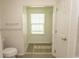 This bathroom includes a toilet, walk-in closet, and tiled floors at 340 Walden Lake Rd., Conway, SC 29526