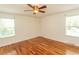 This comfortable bedroom features hardwood floors, a ceiling fan, and plenty of space at 340 Walden Lake Rd., Conway, SC 29526