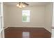 Bedroom with hardwood flooring, ceiling fan, a window and glass paneled doors at 340 Walden Lake Rd., Conway, SC 29526