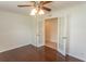Bedroom with hardwood flooring, ceiling fan, and glass paneled doors at 340 Walden Lake Rd., Conway, SC 29526