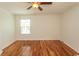 This bedroom features hardwood floors, neutral paint colors and a ceiling fan at 340 Walden Lake Rd., Conway, SC 29526