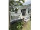 Enjoy outdoor living on this deck with white railings and grey stairs, surrounded by lush landscaping at 340 Walden Lake Rd., Conway, SC 29526
