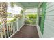 Inviting porch featuring green trim, white rails, and a decorative column at 340 Walden Lake Rd., Conway, SC 29526
