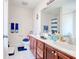Bathroom with double sinks, blue towels, and plentiful counter space at 719 American Beech St., Loris, SC 29569