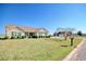 Charming single-story home with a well-manicured lawn and mature landscaping at 719 American Beech St., Loris, SC 29569