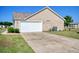 Garage attached to the home with paved driveway at 719 American Beech St., Loris, SC 29569
