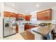 Well-equipped kitchen with stainless steel appliances and a breakfast bar at 719 American Beech St., Loris, SC 29569