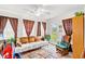 Bright living room with comfortable seating, large windows and access to the outdoors at 719 American Beech St., Loris, SC 29569