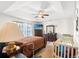 Spacious main bedroom with a vaulted ceiling, ceiling fan, dresser and television at 719 American Beech St., Loris, SC 29569