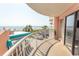 Balcony offering picturesque ocean views of the beach and palm trees at 202 70Th Ave. N # 104, Myrtle Beach, SC 29572