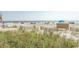 Scenic view of a sandy beach with clear blue water and beachside vegetation at 202 70Th Ave. N # 104, Myrtle Beach, SC 29572