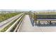 Beach boardwalk with built-in bench, perfect for an oceanside stroll at 202 70Th Ave. N # 104, Myrtle Beach, SC 29572