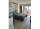 Comfortable bedroom with beach view, gray linens, and a private balcony at 202 70Th Ave. N # 104, Myrtle Beach, SC 29572