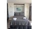 Comfortable bedroom with a Murphy bed and built-in cabinets at 202 70Th Ave. N # 104, Myrtle Beach, SC 29572