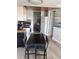 Open-concept kitchen and dining area with white cabinets and modern appliances at 202 70Th Ave. N # 104, Myrtle Beach, SC 29572