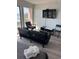 Relaxing living room with ocean views, a comfy sofa, and a wall-mounted television at 202 70Th Ave. N # 104, Myrtle Beach, SC 29572
