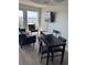 Relaxing living room with ocean views, a comfy sofa, and a wall-mounted television at 202 70Th Ave. N # 104, Myrtle Beach, SC 29572