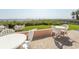 Outdoor seating area with tables overlooking the beach, perfect for relaxing at 202 70Th Ave. N # 104, Myrtle Beach, SC 29572