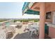 Outdoor patio area with tables and chairs, perfect for dining and enjoying the ocean view at 202 70Th Ave. N # 104, Myrtle Beach, SC 29572