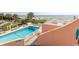Inviting pool surrounded by lounge chairs, umbrellas, and ocean views from the deck at 202 70Th Ave. N # 104, Myrtle Beach, SC 29572
