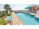 Inviting swimming pool with clear water, lounge chairs, and a view of the beach at 202 70Th Ave. N # 104, Myrtle Beach, SC 29572