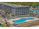 Aerial view of a condo building with pool and parking at 5905 South Kings Hwy. # A450, Myrtle Beach, SC 29575