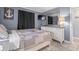 Bedroom with a dresser, TV and comfortable bedding at 5905 South Kings Hwy. # A450, Myrtle Beach, SC 29575