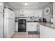 Clean and bright kitchen with white cabinets and granite countertops at 5905 South Kings Hwy. # A450, Myrtle Beach, SC 29575