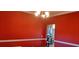 A dining room with a chandelier and red walls opens to another room with an archway at 78 Joys Pl., Andrews, SC 29510
