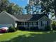 Charming single-story home with a well-maintained lawn and a welcoming front porch at 78 Joys Pl., Andrews, SC 29510