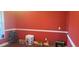 The living room features red walls and white trim, offering a simple yet elegant space at 78 Joys Pl., Andrews, SC 29510
