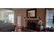 Cozy living room with a stone fireplace and a large window for natural light at 78 Joys Pl., Andrews, SC 29510
