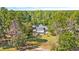 Aerial view of a home on a large lot with a spacious backyard and mature trees at 1296 Foxtail Dr., Longs, SC 29568