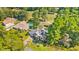 Aerial view of a home surrounded by mature trees, landscaped grounds, and a long driveway at 1296 Foxtail Dr., Longs, SC 29568