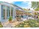 Backyard featuring a patio, dining set, outdoor seating, a fountain and a sunroom at 1296 Foxtail Dr., Longs, SC 29568