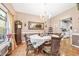 Dining room with hardwood floors, a chandelier, and views into the kitchen at 1296 Foxtail Dr., Longs, SC 29568